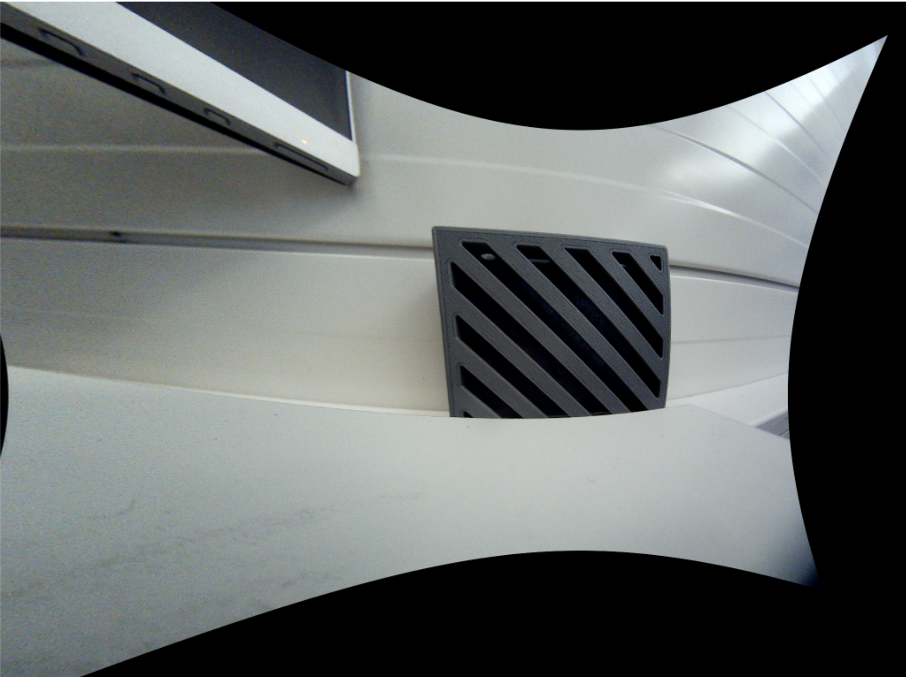 Illustration of the fisheye distortion correction process. (b) displays the image after distortion correction but before cropping.